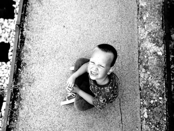 Portrait of boy sitting outdoors