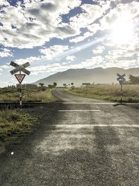 Road sign against sky