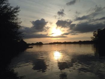 Scenic view of lake at sunset