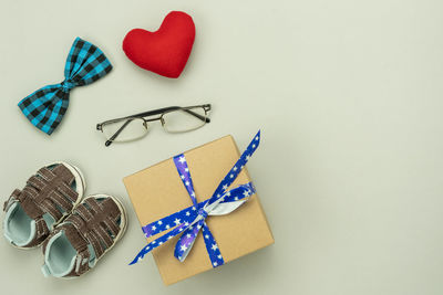 High angle view of heart shape on table against white background