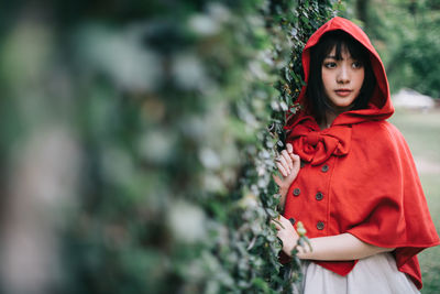 Portrait of a young woman standing outdoors