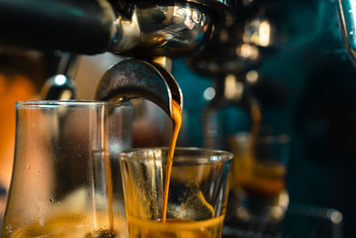 Close-up of coffee cups in glass