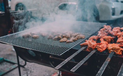 Close-up of meat on barbecue grill