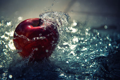 Close-up of water splashing in glass