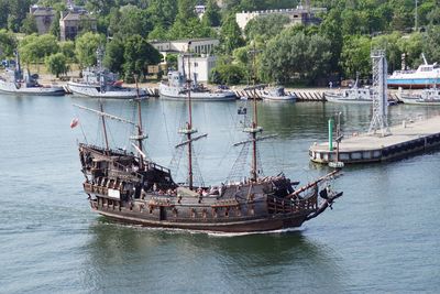 Boats moored in river