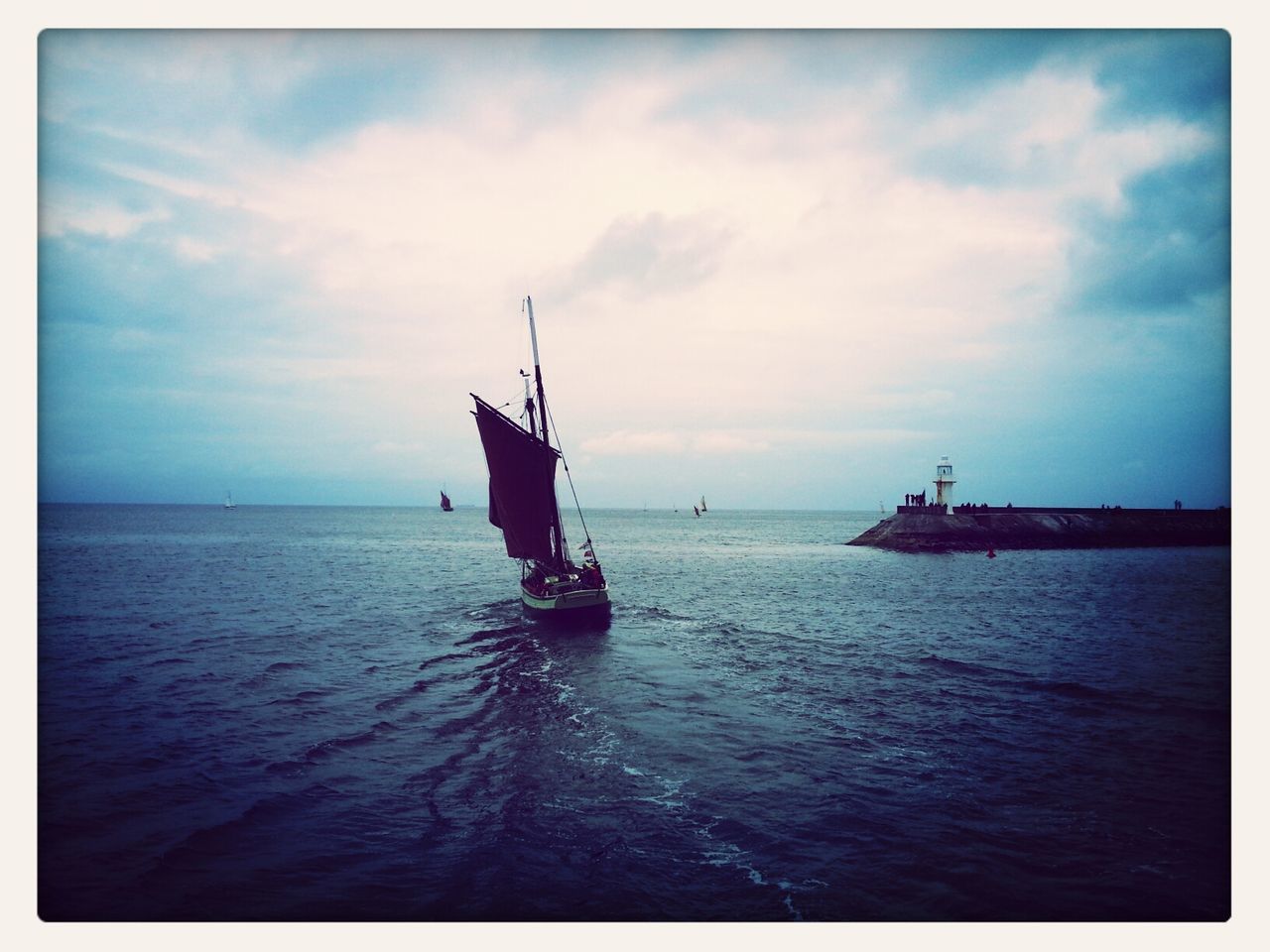 nautical vessel, transportation, sea, water, boat, mode of transport, horizon over water, sky, transfer print, tranquility, tranquil scene, cloud - sky, sailing, nature, scenics, beauty in nature, waterfront, auto post production filter, sailboat, cloud