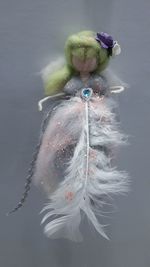 Close-up of toy fish against gray background