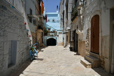 A small street in casamassima, a village with blue-colored houses in the puglia region of italy.