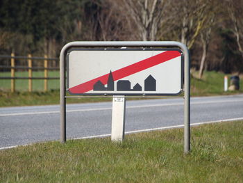 Road sign on field