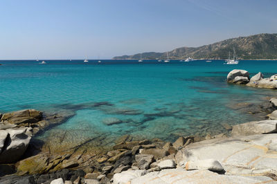 Scenic view of sea against clear blue sky