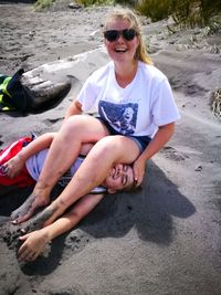 Smiling young woman on beach