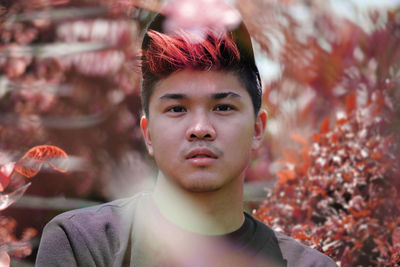 Close-up portrait of man standing in autumn