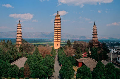 Panoramic view of buildings in city against sky