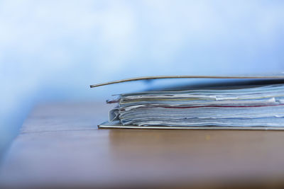 Close-up of file on wooden table