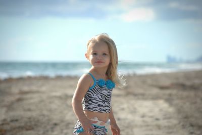 Portrait of woman standing on beach