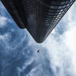Low angle view of airplane flying in sky