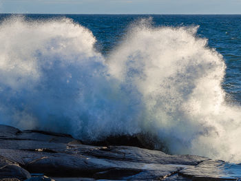 Sea waves splashing on rocks