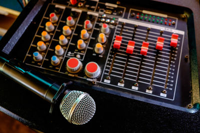 High angle view of microphone on audio equipment