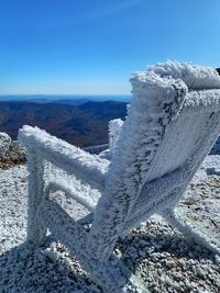 Scenic view of snowcapped mountain against blue sky