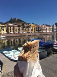 Close-up of food in city against clear sky