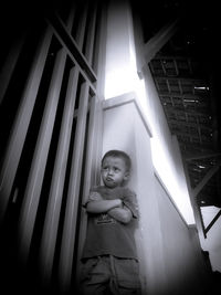 Portrait of cute girl standing at home