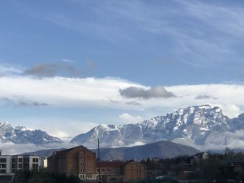 Buildings in city against sky