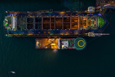 Shipyard repair on the sea at night aerial top view