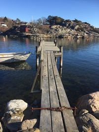 Pier over lake against sky