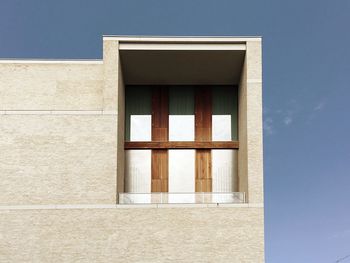 Low angle view of built structure against blue sky