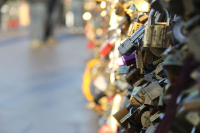 Close-up of padlocks on railing