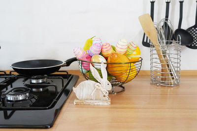 Easter bouquet and eggs on the table in white scandinavian-style kitchen. 