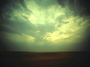 Scenic view of landscape against cloudy sky