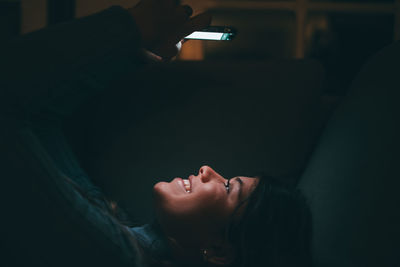 Close-up of woman sitting at home