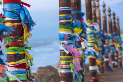 Close-up of multi colored umbrellas hanging at beach