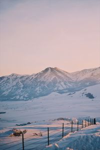 Scenic view of snowcapped mountain against sky during winter