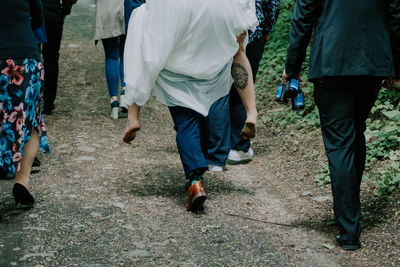 Low section of people walking outdoors