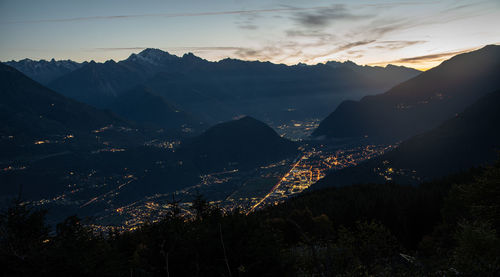 Scenic view of mountains against sky at night