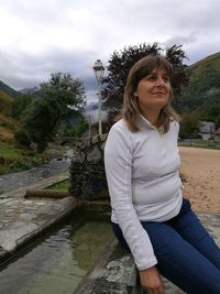 High angle view of woman standing by river