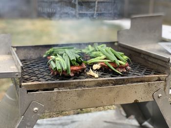 High angle view of meat on barbecue grill