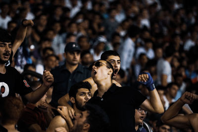 Group of people looking at music concert