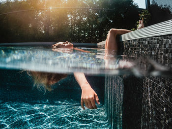 6 years old girl relaxing and bathing in a swimming pool