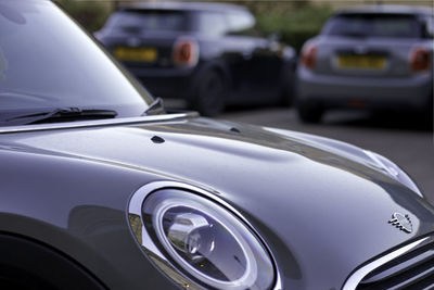 Close-up of car on road