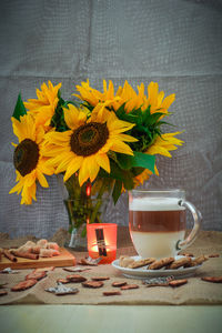 Close-up of sunflowers in vase on table