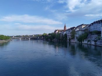 View of bridge over river against cloudy sky