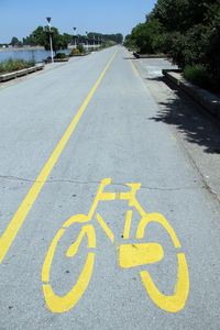 High angle view of bicycle lane sign on road