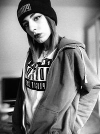 Portrait of young woman wearing hat