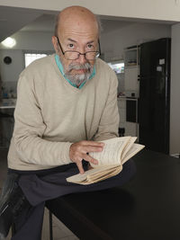Portrait of senior man using mobile phone
