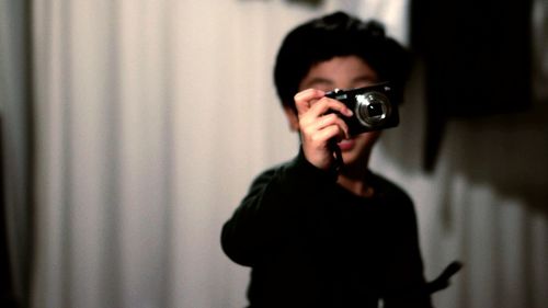 Boy holding camera