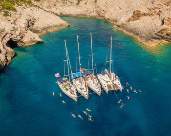 High angle view of sailboats in sea