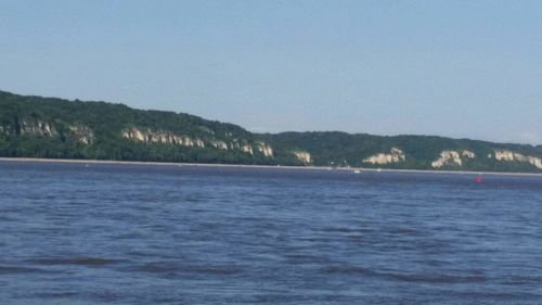 Scenic view of calm sea against blue sky